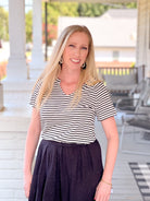 short sleeve shirt with black and white stripes and v neckline