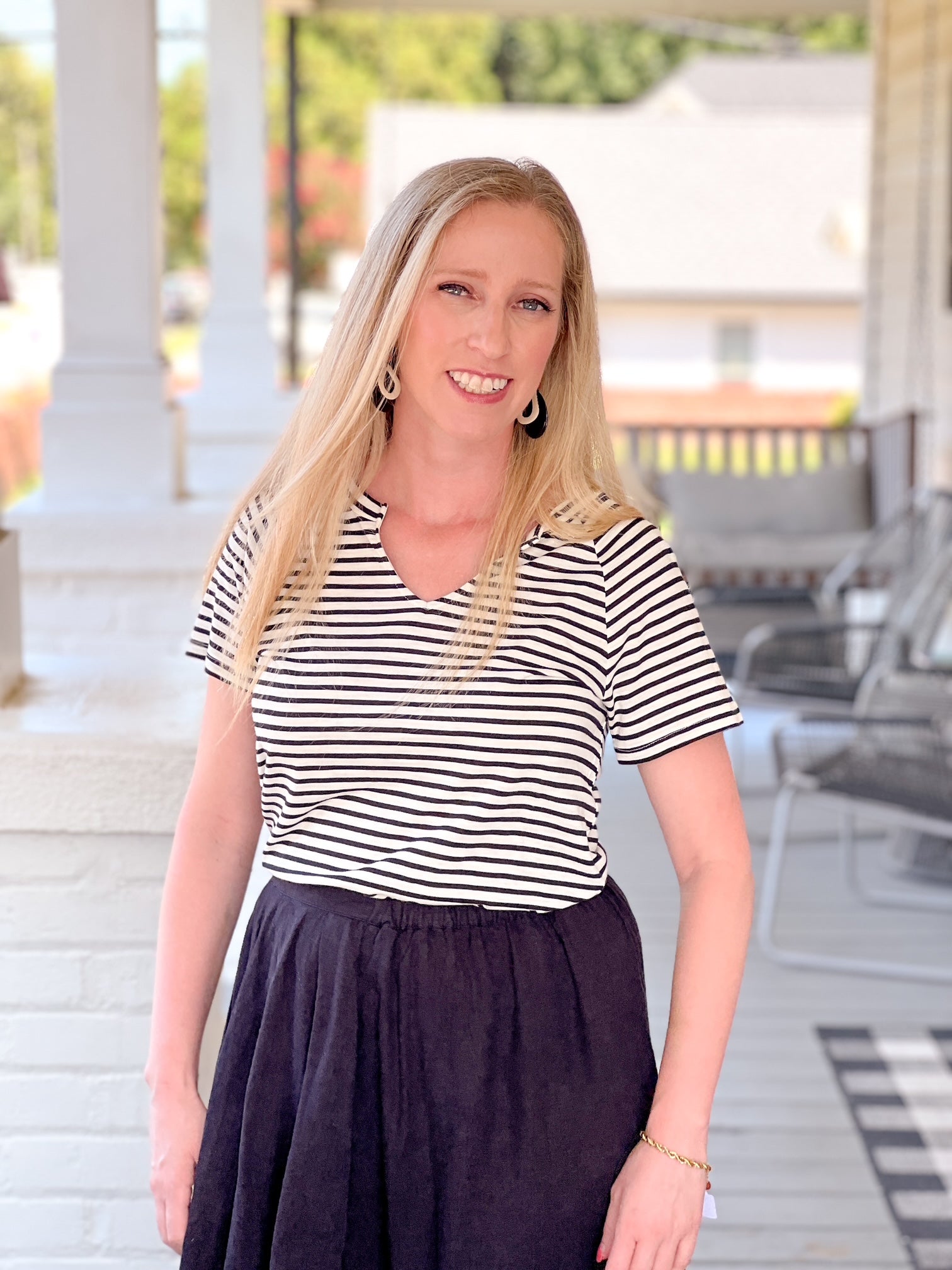 short sleeve shirt with black and white stripes and v neckline