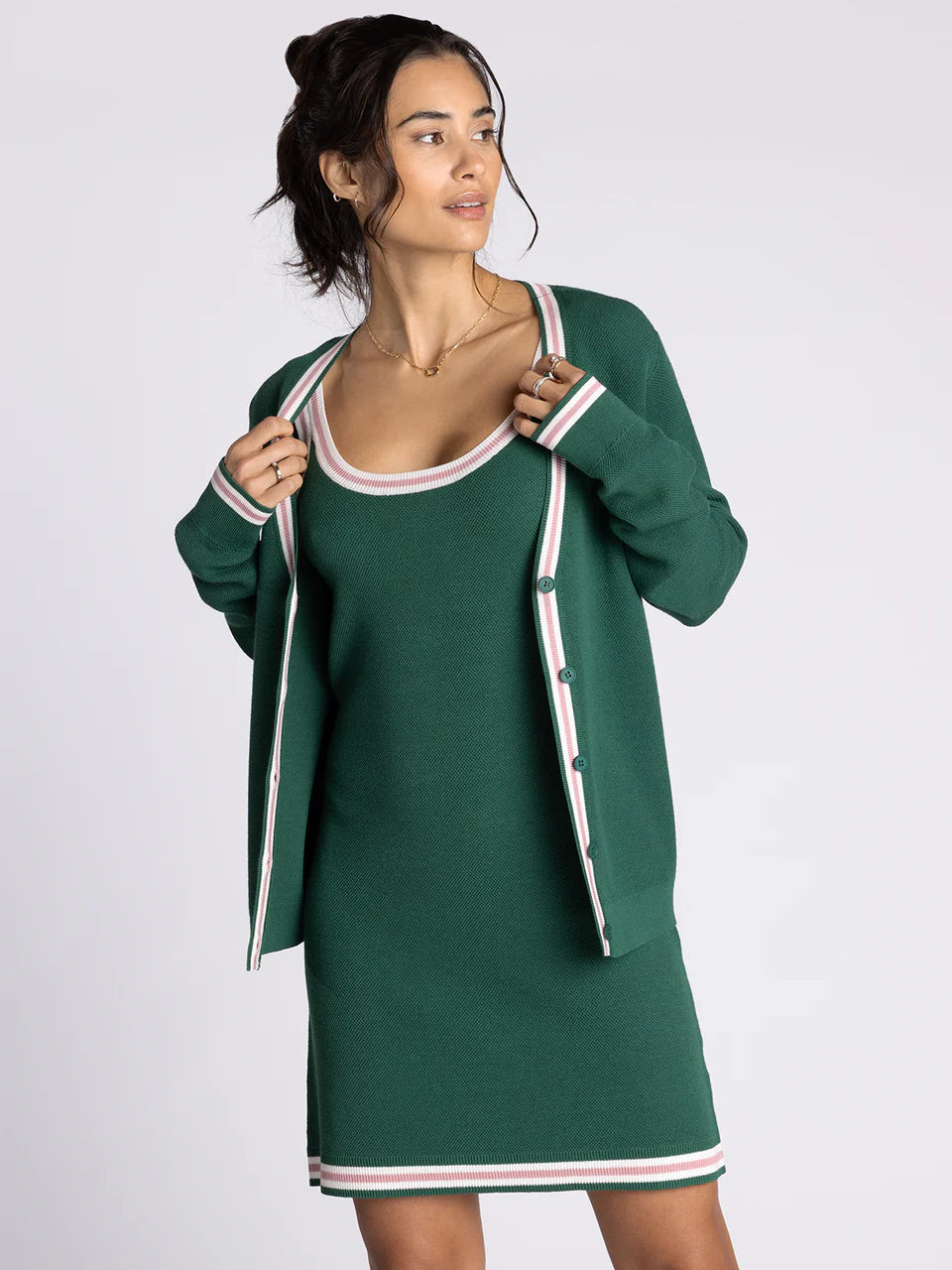 green cardigan with white and pink stripe outline