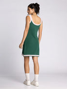 green tennis dress with white and pink outline, mini length, sleeveless
