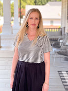 short sleeve shirt with black and white stripes and v neckline