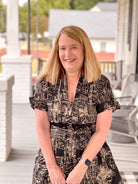 black dress with taupe pattern, midi length, v neckline