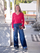 red v neck top with long sleeves