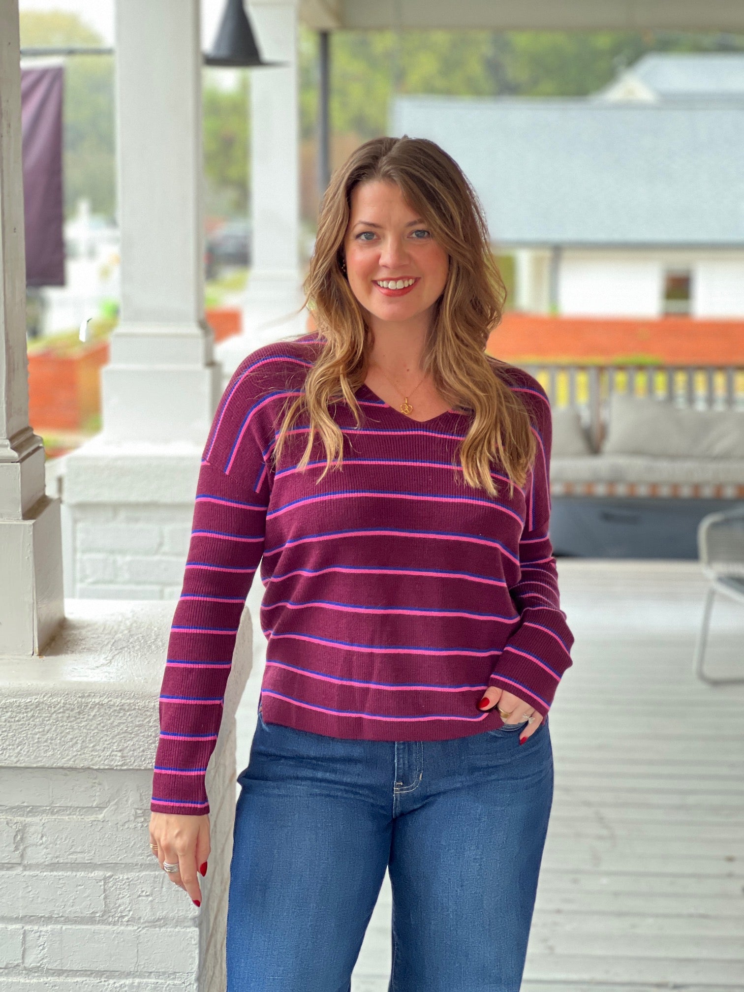 wine sweater with v neckline and long sleeves, small stripes