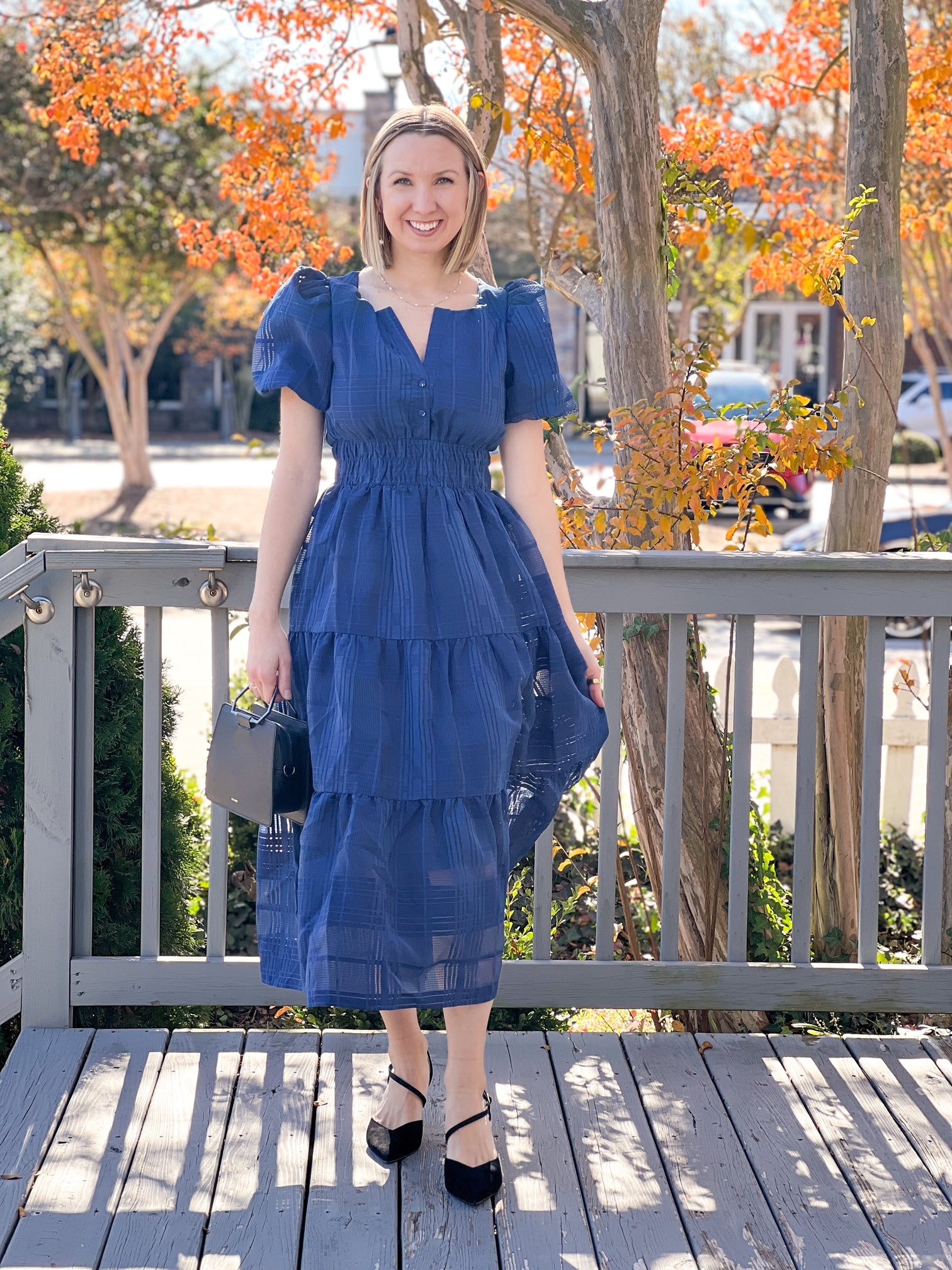 midi length navy dress with puff sleeves