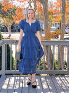midi length navy dress with puff sleeves