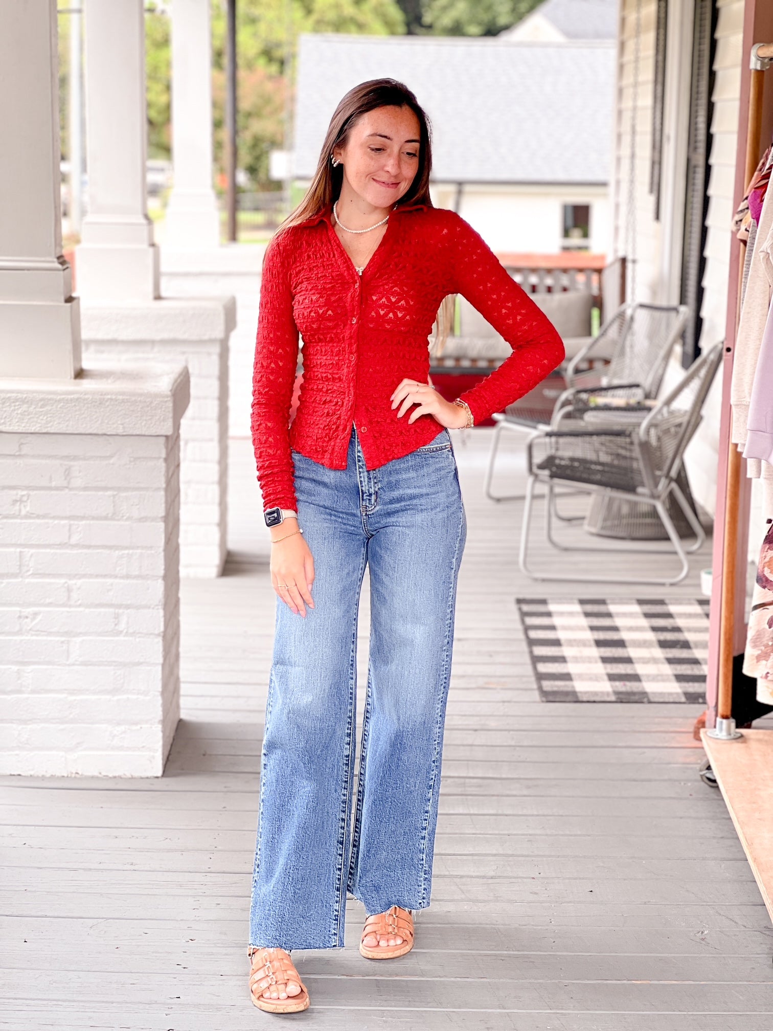 red long sleeve collared v neckline button front top