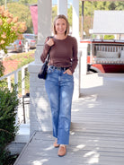 dark brown long sleeve top with crew neckline