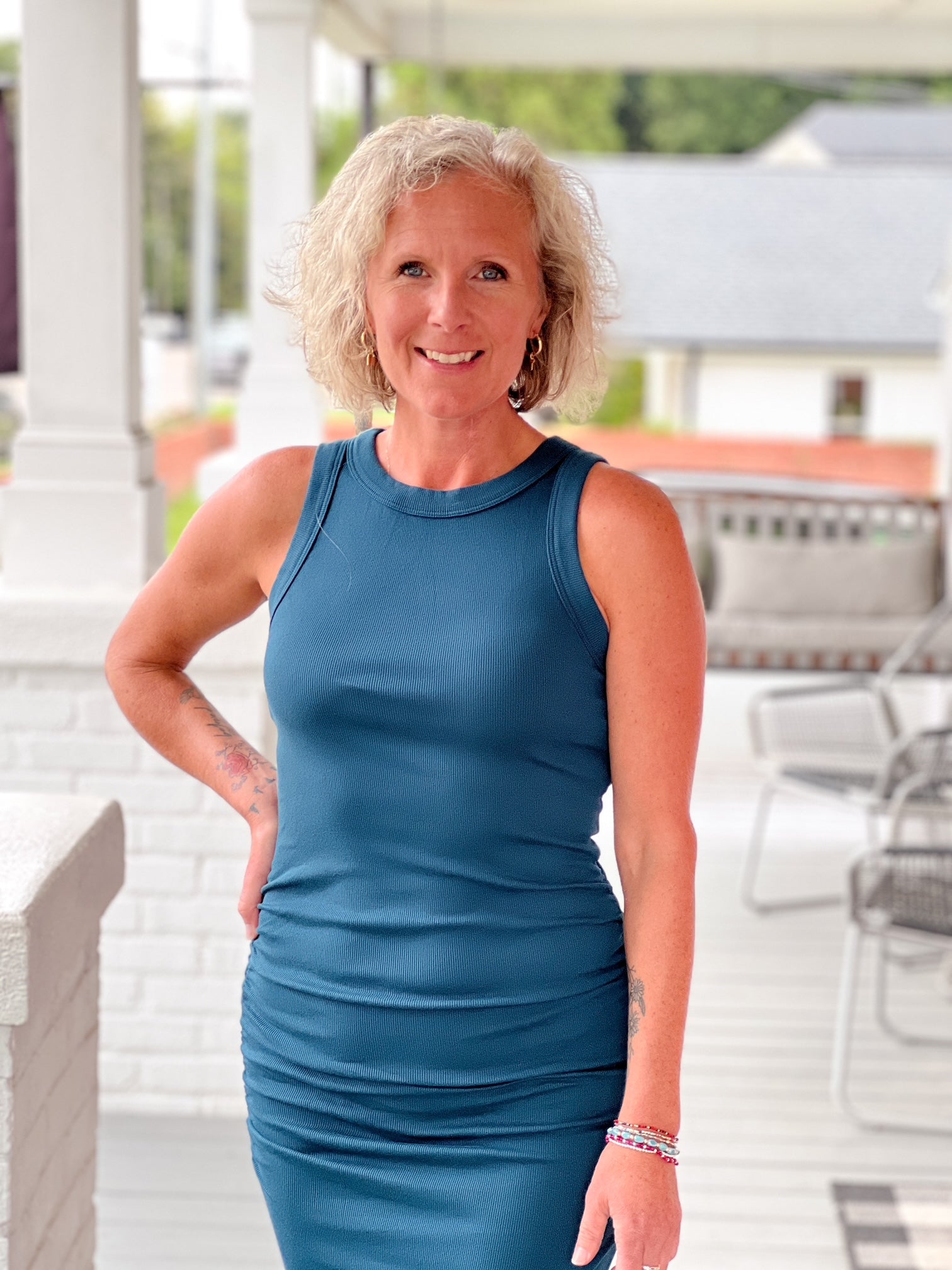 form fitting teal dress, sleeveless