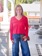red v neck top with long sleeves