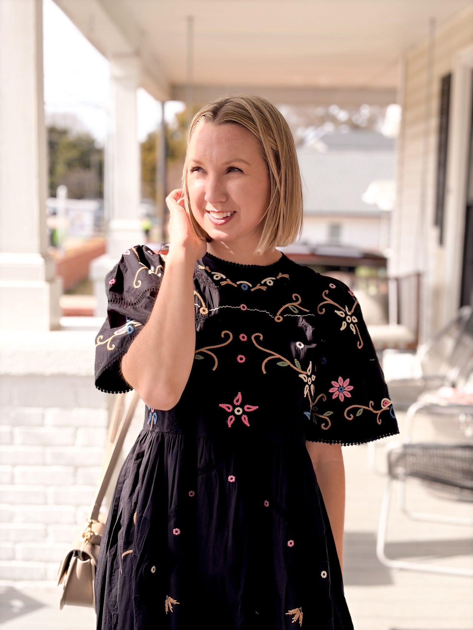 black midi length short sleeve dress with colorful embroidery 