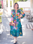 green floral dress, maxi length, with v neckline