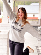 grey sweatshirt day drinking game day written on it, reversible