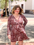 brown and cream patterned mini dress with v neckline