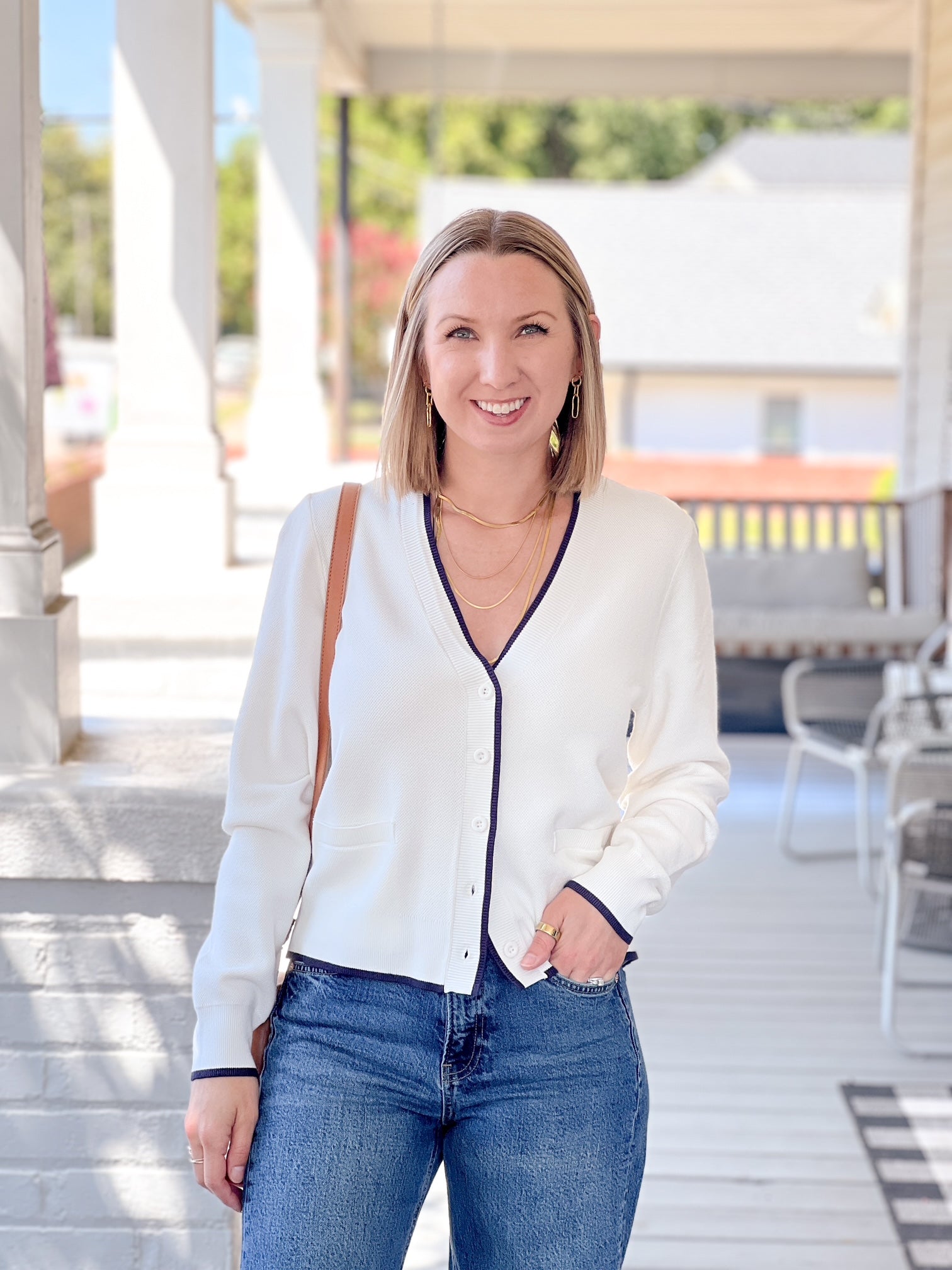 white cardigan with navy outline