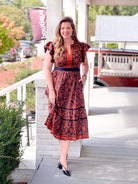 midi length dress with floral detailing