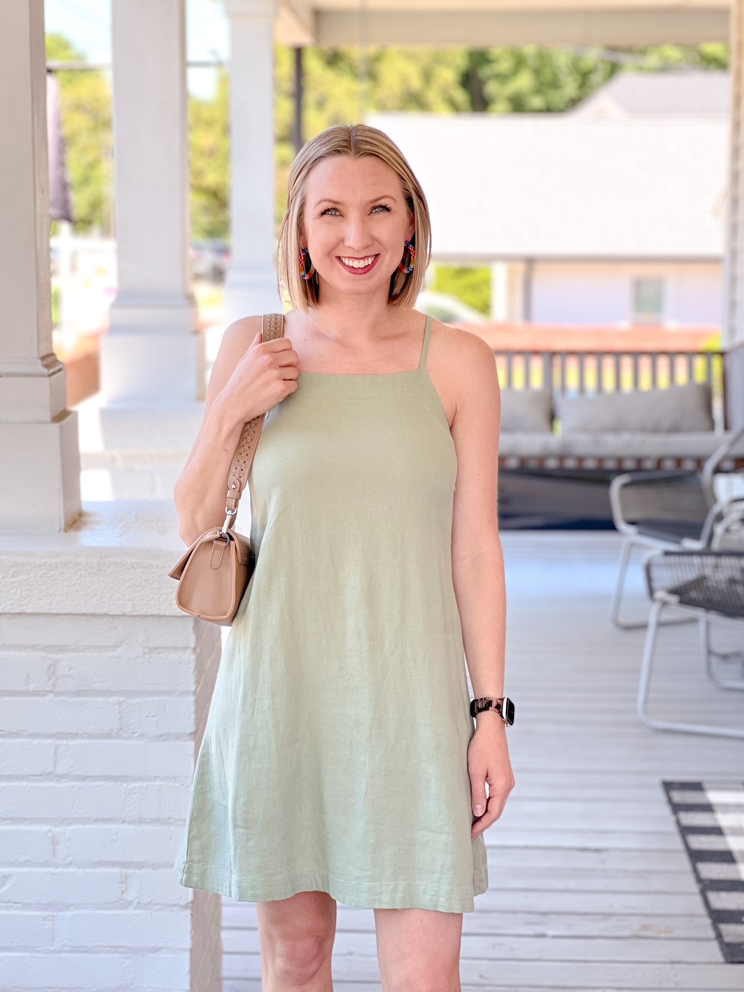 light green sleeveless dress with tie back detail