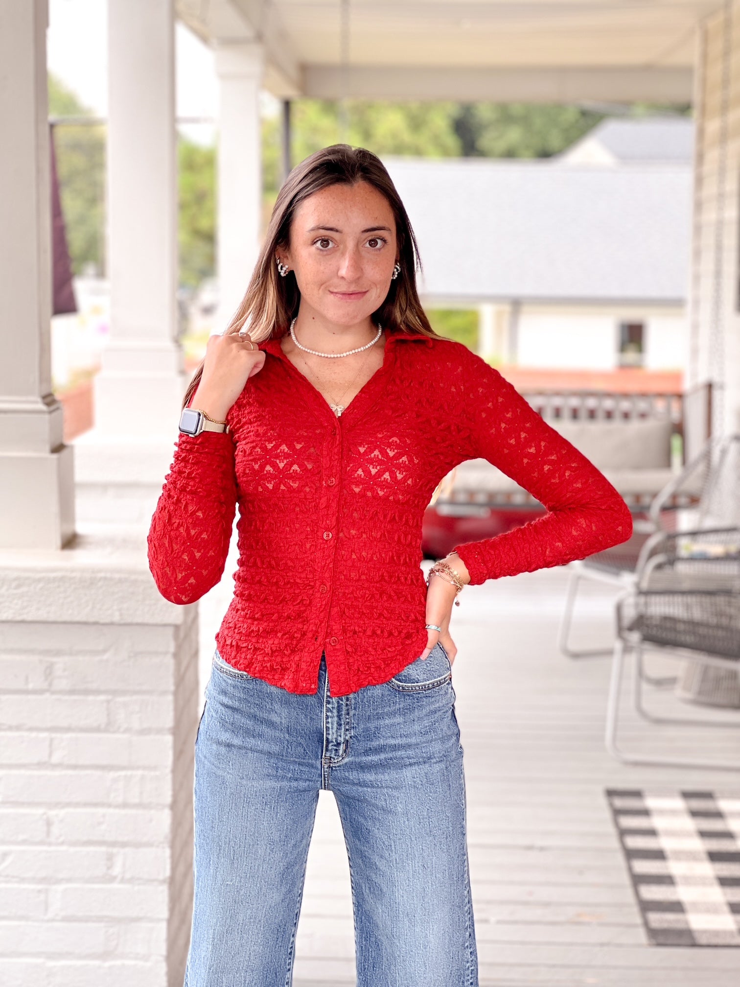 red long sleeve collared v neckline button front top