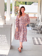 mauve brown pattern dress with v neckline, midi length