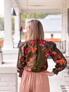 long sleeve work top in olive with pink and orange floral pattern