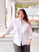 white button up top with gold stripes