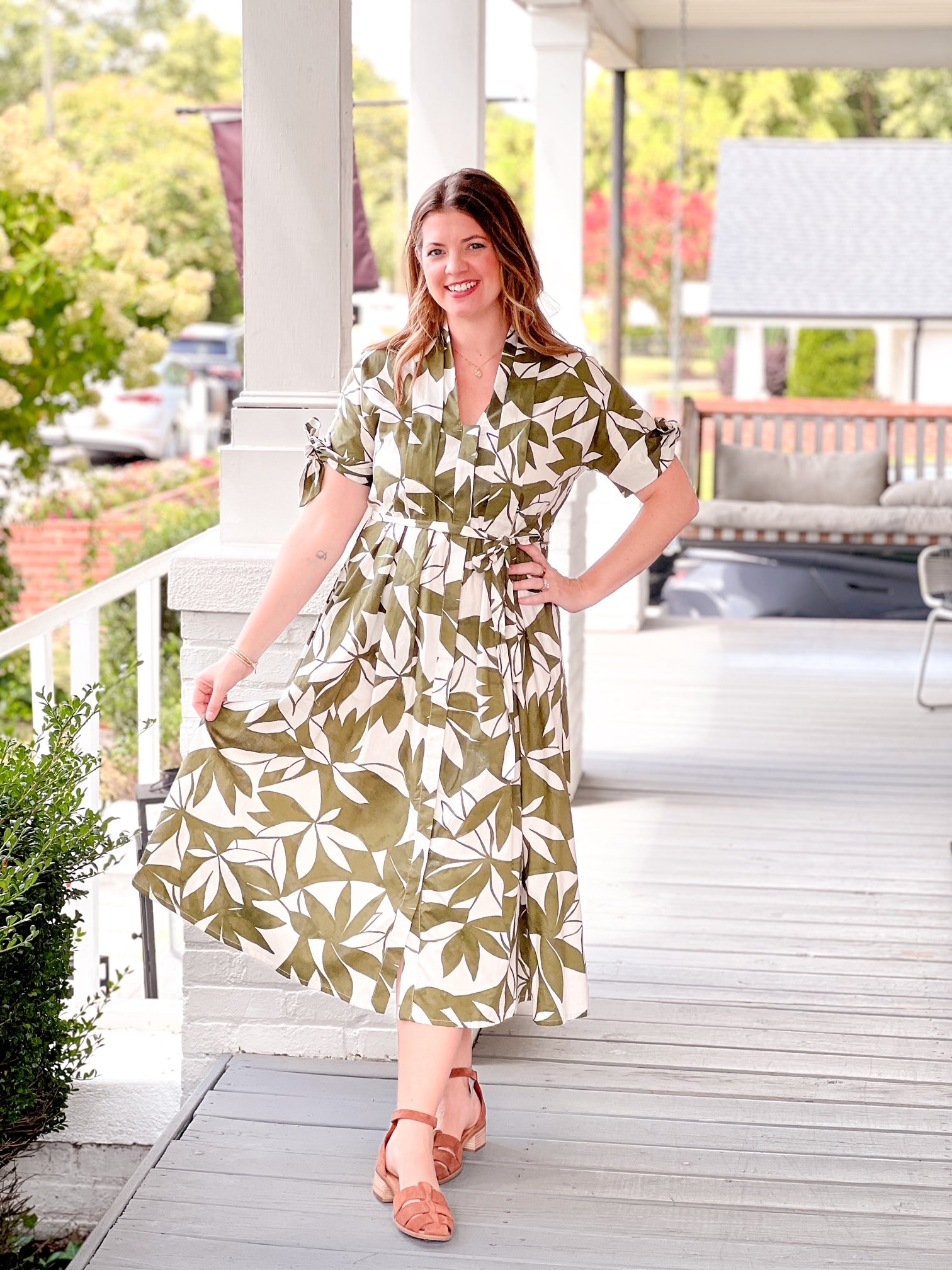 olive green dress with short sleeves, midi length, leaf pattern