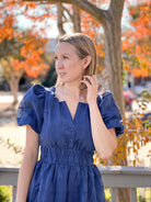 midi length navy dress with puff sleeves