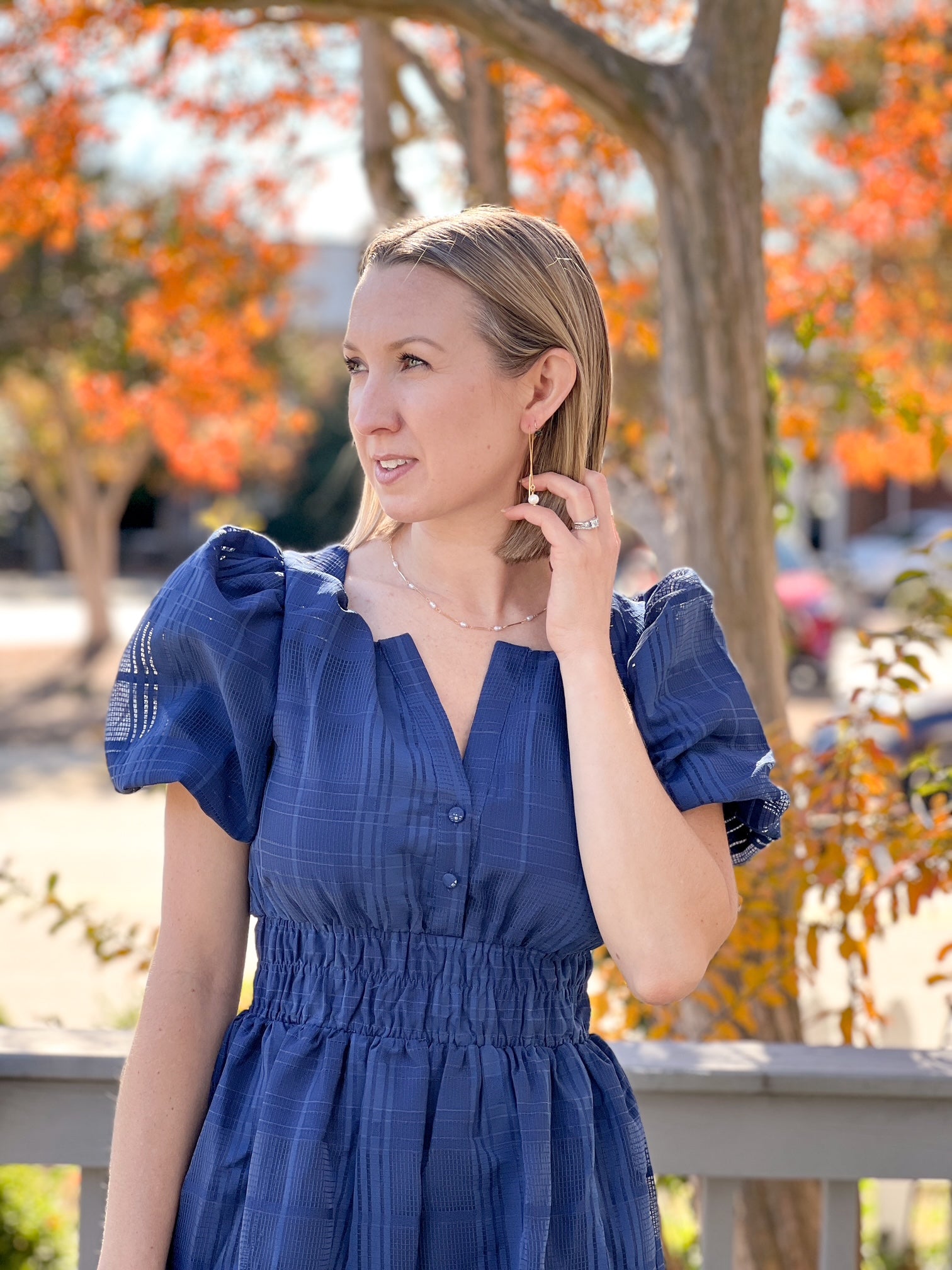 midi length navy dress with puff sleeves