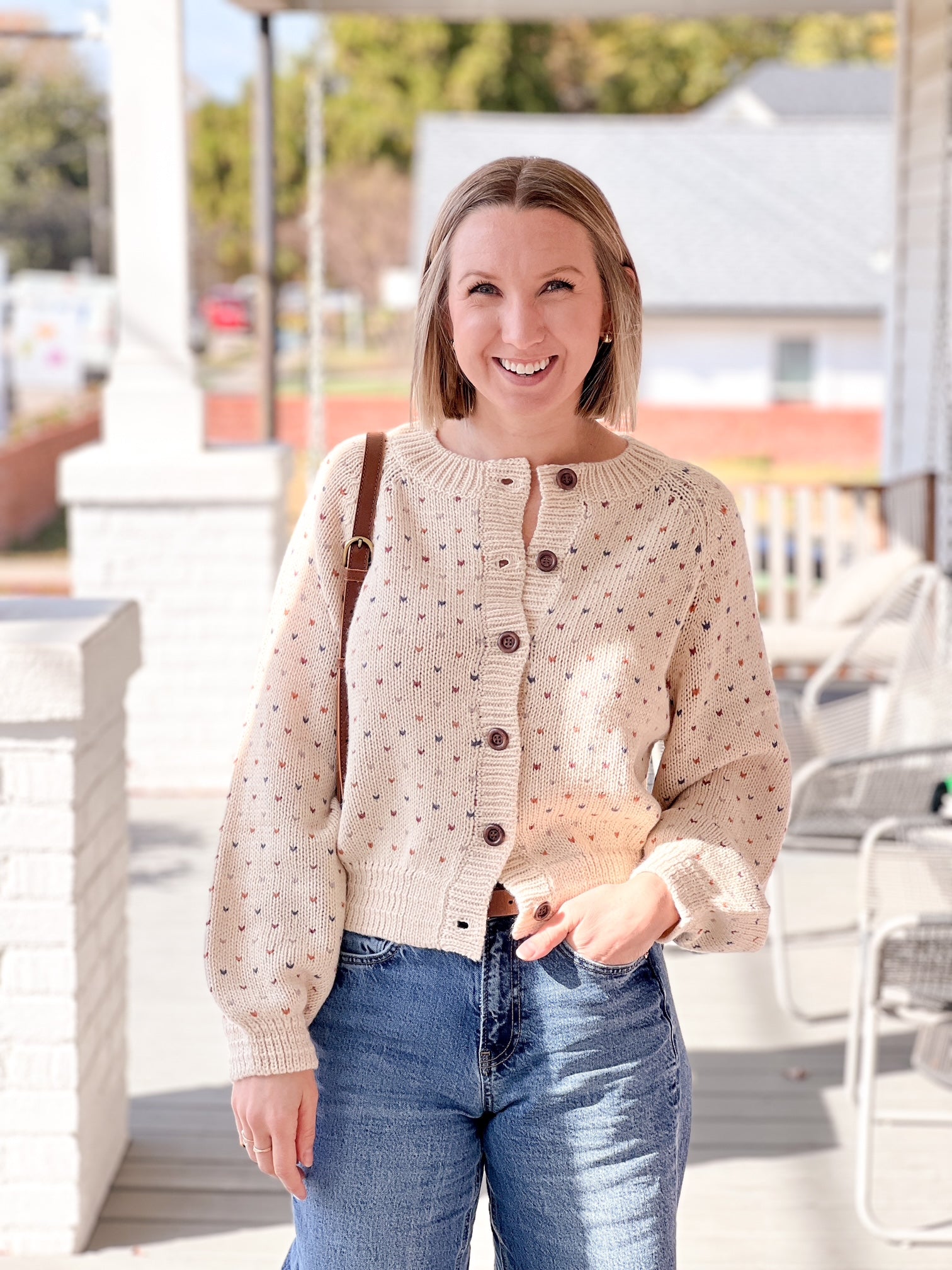 beige cardigan with tiny multi colored hearts