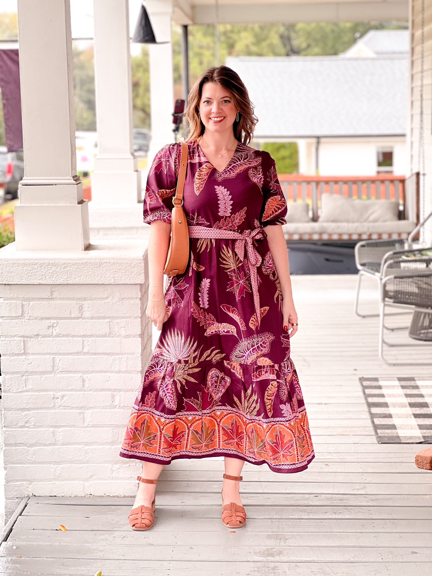 wine colored dress with leaf pattern, v neckline, a line fit