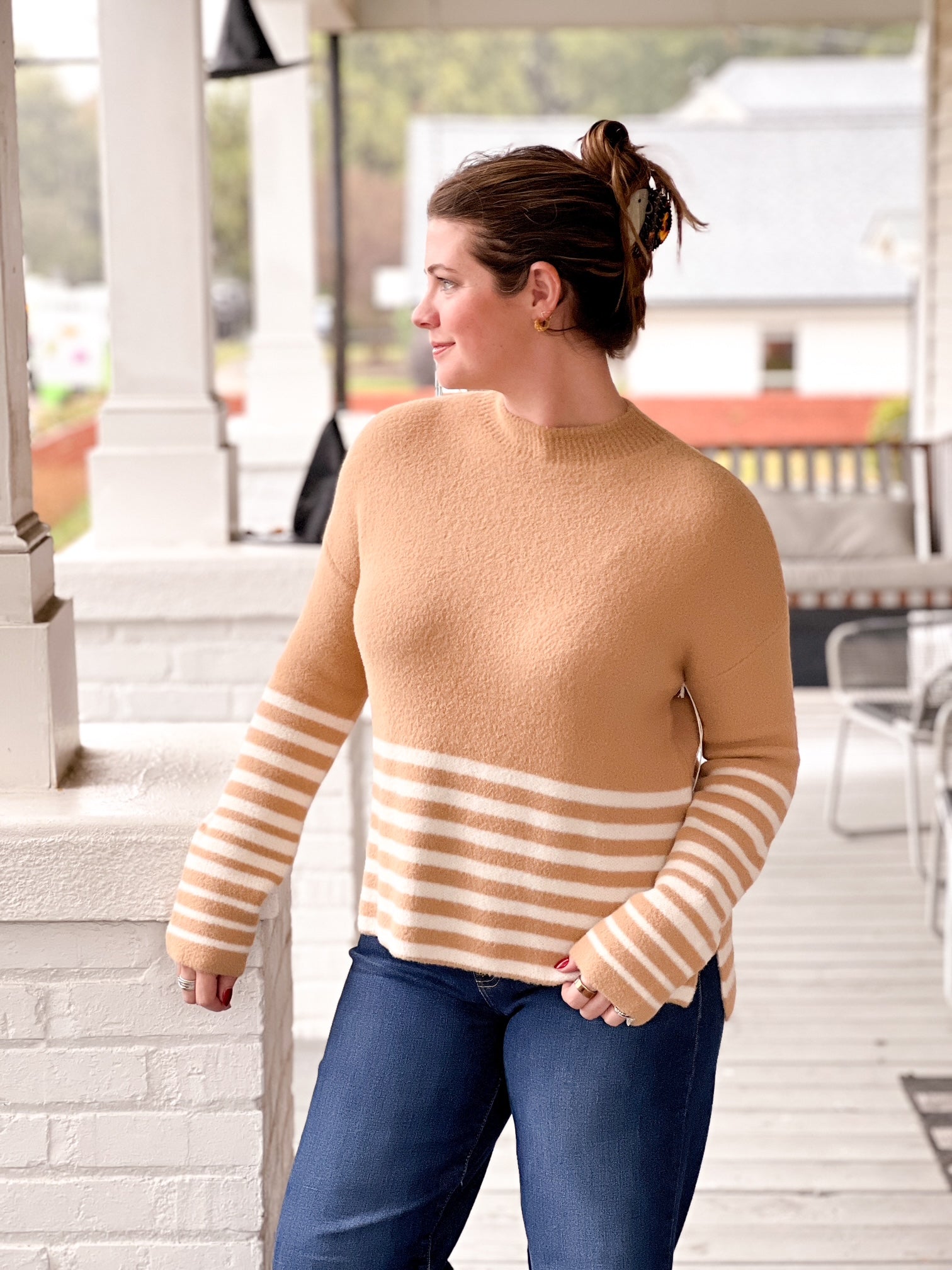 caramel sweater with white stripe detailing on bottom