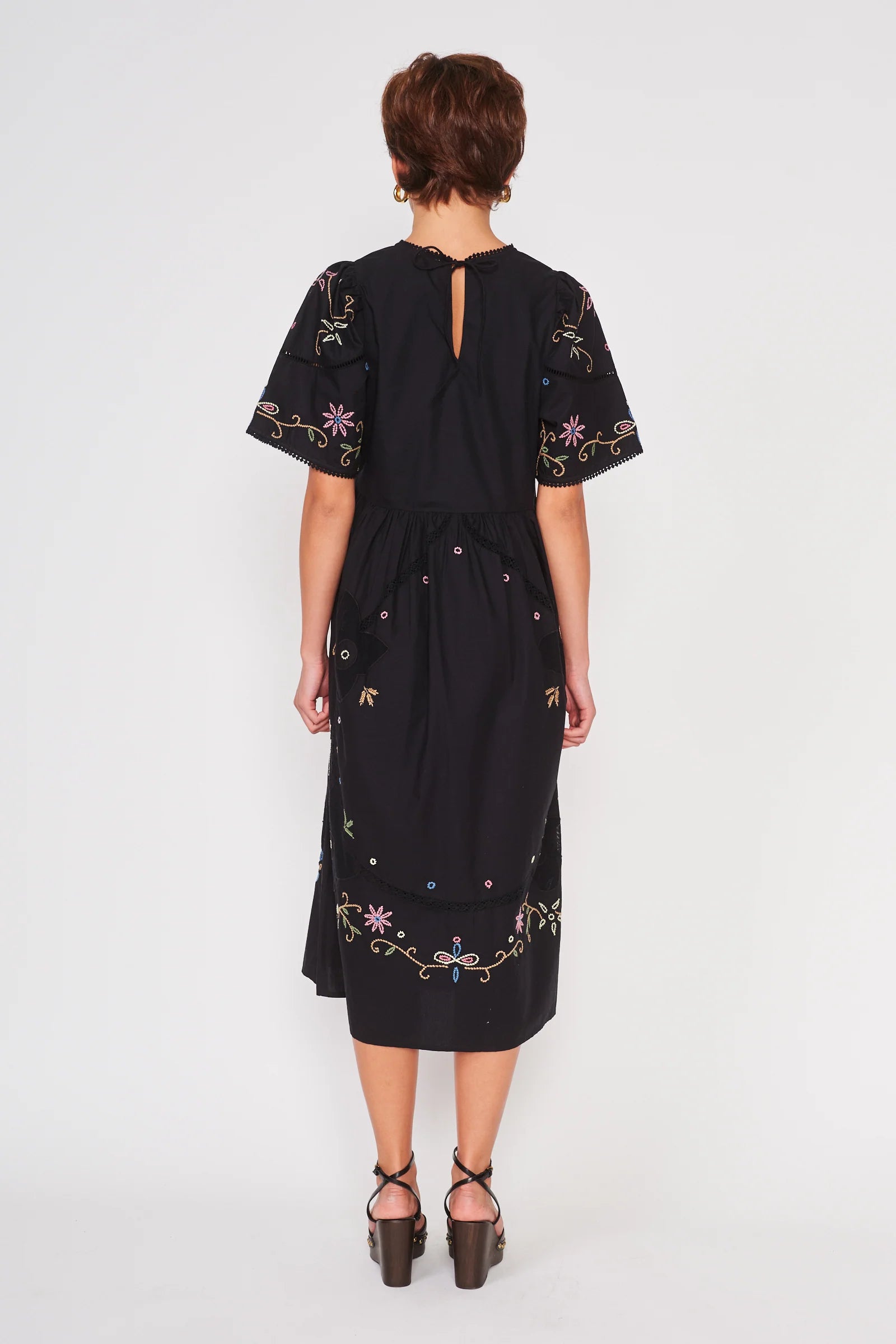 black midi length short sleeve dress with colorful embroidery 