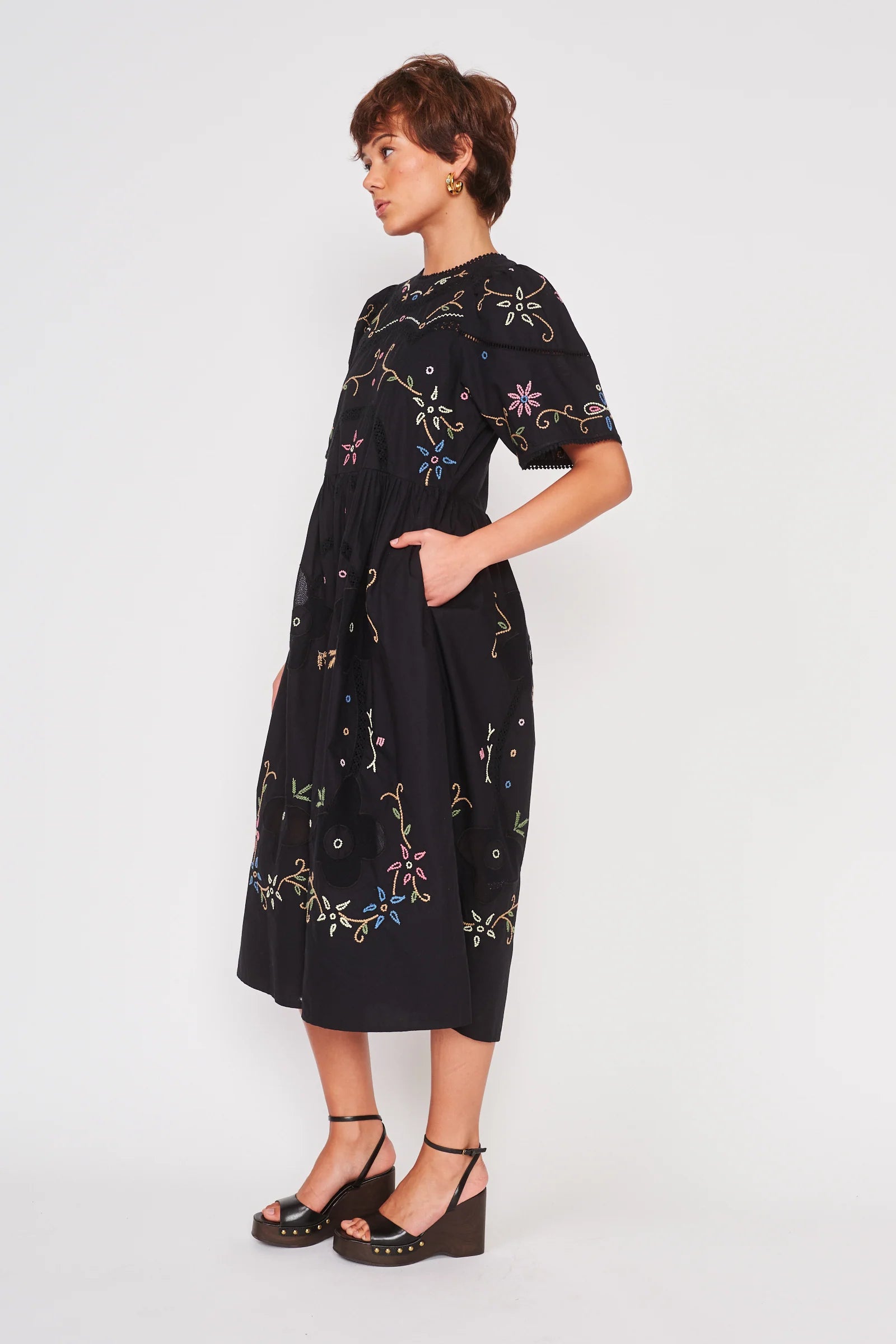 black midi length short sleeve dress with colorful embroidery 