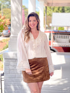 white long sleeve blouse with v neckline