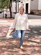 sweatshirt with light lavender stripes and v neckline