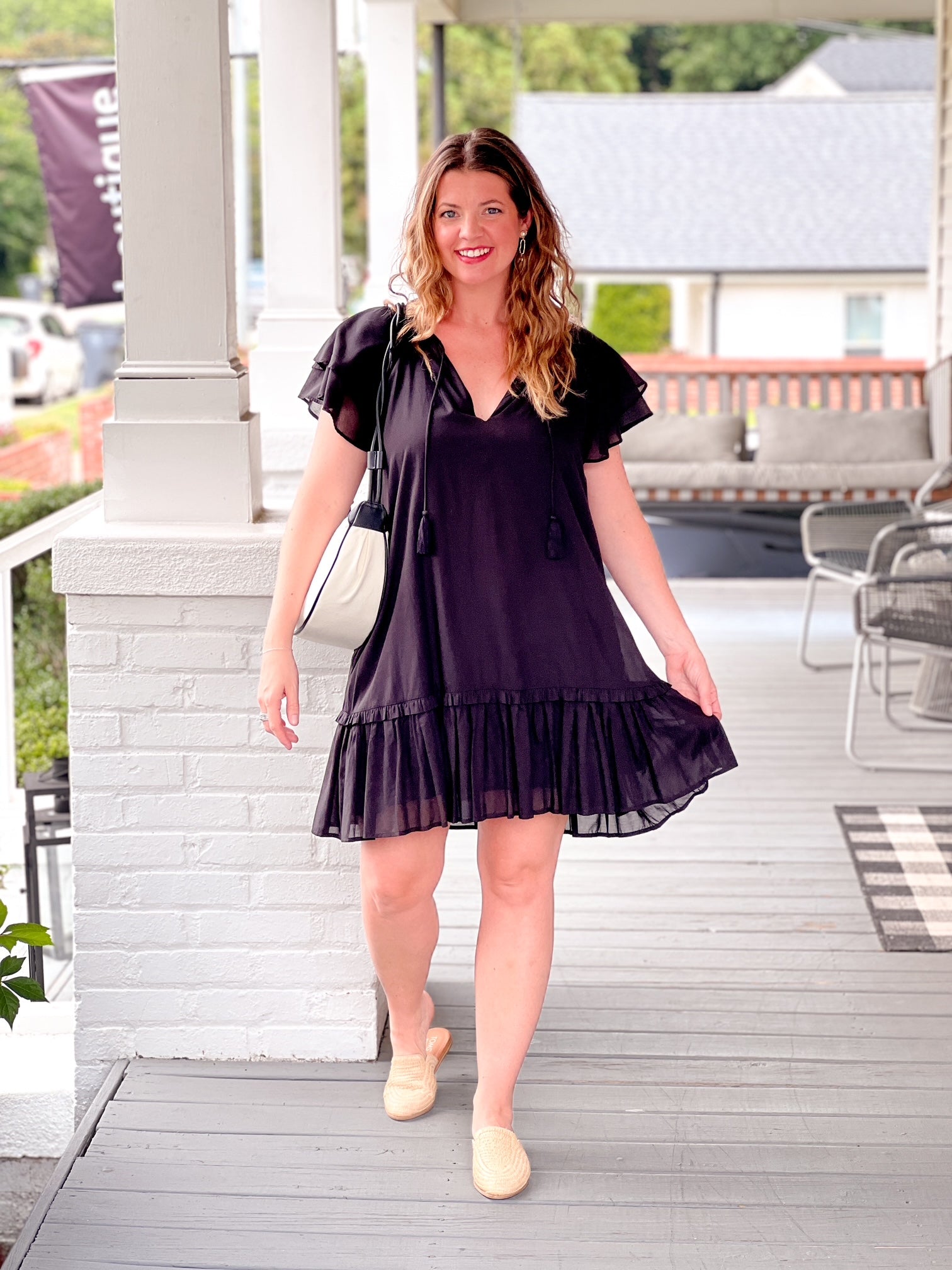black tiered mini length dress with split neckline
