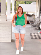 bright green sleeveless top with v neckline