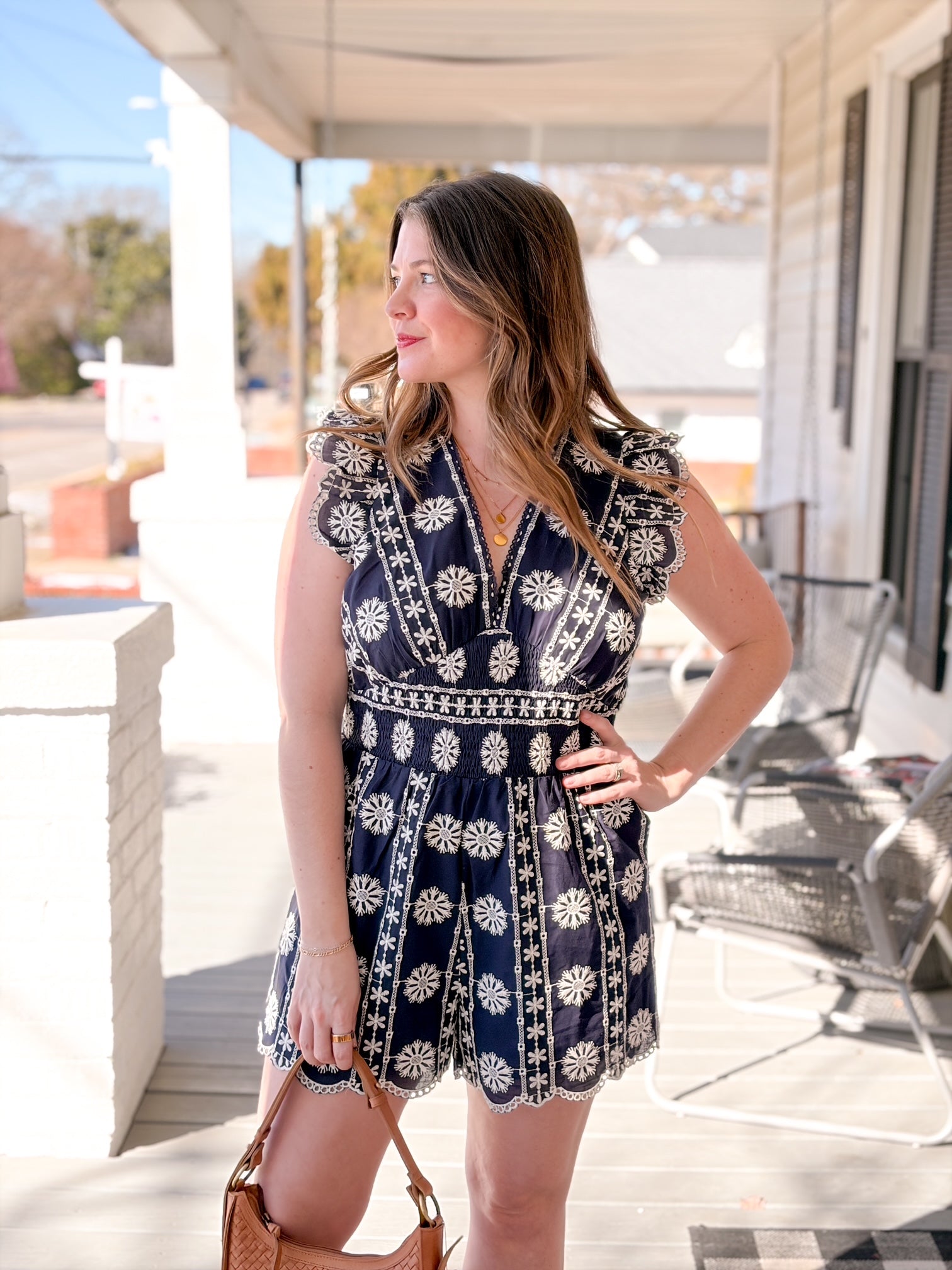 navy romper with white eyelet detailing