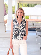 green and ivory tropical print top for workwear, button up front, sleeveless