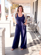 navy jumpsuit, wide leg, sleeveless