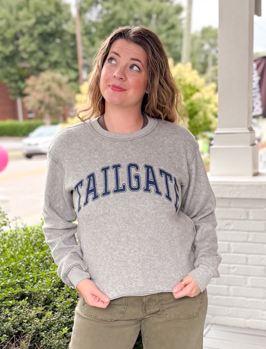 reversible grey hoodie with tailgate written on one side and touchdown written on the other