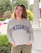 reversible grey hoodie with tailgate written on one side and touchdown written on the other