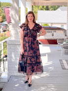 plum and brown floral midi length dress with v neckline
