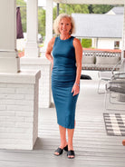 form fitting teal dress, sleeveless