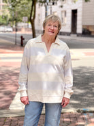 sweatshirt with light lavender stripes and v neckline